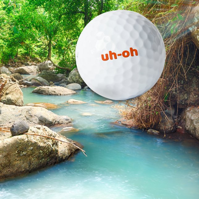 Funny Simple 'uh-oh' Golfing Humour Novelty Golf Balls (A humorous golf ball with 'uh-oh' slogan in orange on classic white)
