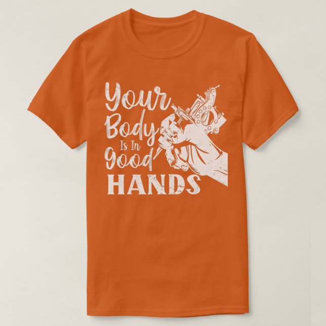Funny Tattoo Artist Your Body Is In Good Hands Tat T-Shirt (Design Front)
