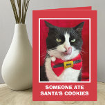 Funny Tuxedo Cat Christmas Card<br><div class="desc">This funny tuxedo cat Christmas card features a tuxedo cat on the front with her tongue sticking out. The words, "Someone ate Santa's cookies" appear right below the photo. Inside the card reads, "I hope there are other suspects! Meowy Christmas". This is a very fun Christmas card for the cat...</div>
