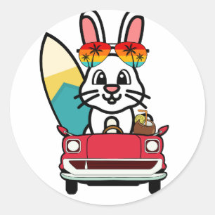 Funny white rabbit is driving to the beach classic round sticker