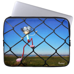 Furry little creature climbing up a fence. laptop sleeve