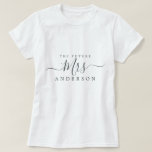 Future Mrs Chic Script Custom Name Bride to be T-Shirt<br><div class="desc">Future Mrs modern black and white custom name t-shirt with the text Mrs in black elegant script calligraphy. Simply add the married name of the bride to be and the perfect bridal shower gift is ready for you to give. Exclusively designed for you by Happy Dolphin Studio.</div>