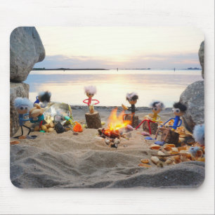 Fuzzy little dolls eating pistachio nuts by the ca mouse pad