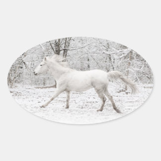 Galloping White Horse in the Snow Oval Sticker