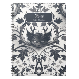 Gargoyle silhouettes intertwined with thorny vines notebook
