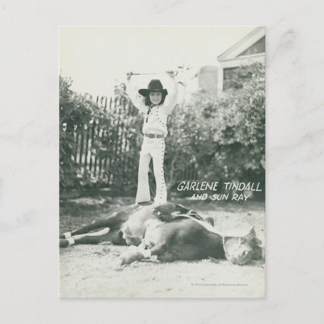 Garlene Tindall standing on a trick horse. Postcard (Front)