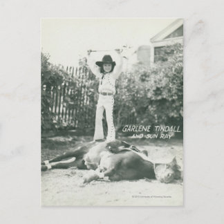 Garlene Tindall standing on a trick horse. Postcard