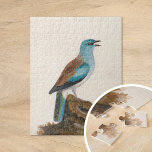 Garrulous Roller | William Lewin Jigsaw Puzzle<br><div class="desc">Garrulous Roller (before 1790) | William Lewin’s Garrulous Roller is a vibrant and meticulously detailed painting showcasing a striking brown and turquoise roller perched on a log against a minimalist neutral background. The artist masterfully captures the bird’s vivid plumage and poised stance, emphasizing its natural beauty. The understated backdrop draws...</div>