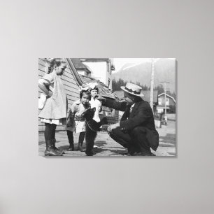 Gentleman and Kids Playing with Bear Cub On Leas Canvas Print