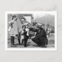 Gentleman and Kids Playing with Bear Cub On Leas