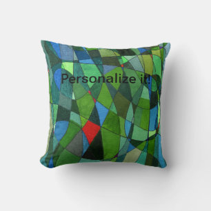 Gently curved shapes in cool greens & red accents cushion