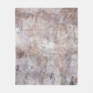Genuine vintage washouts on the wooden surfaceaged fleece blanket