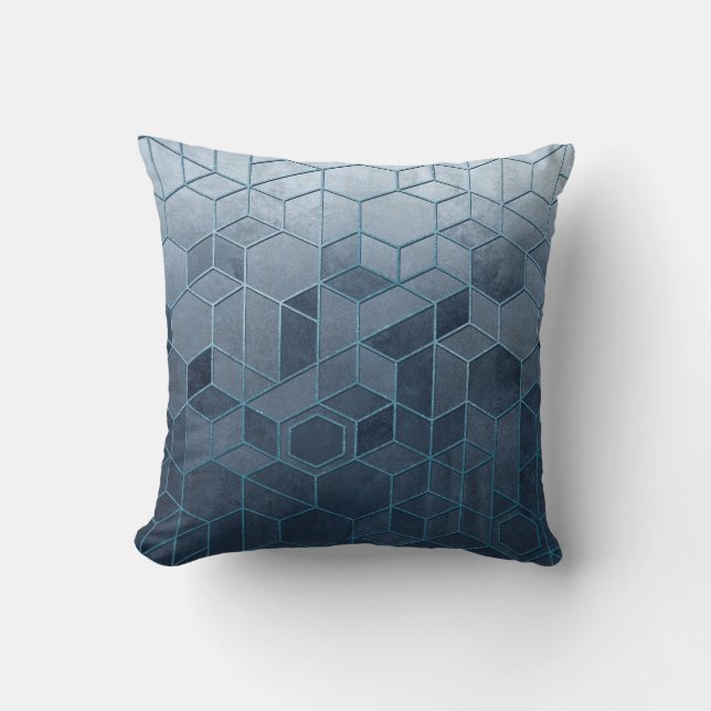 Geometric abstraction of hexagons on a blue relief cushion (Front)