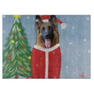 German Shepherd Dog in Snow with Christmas Gifts Cutting Board