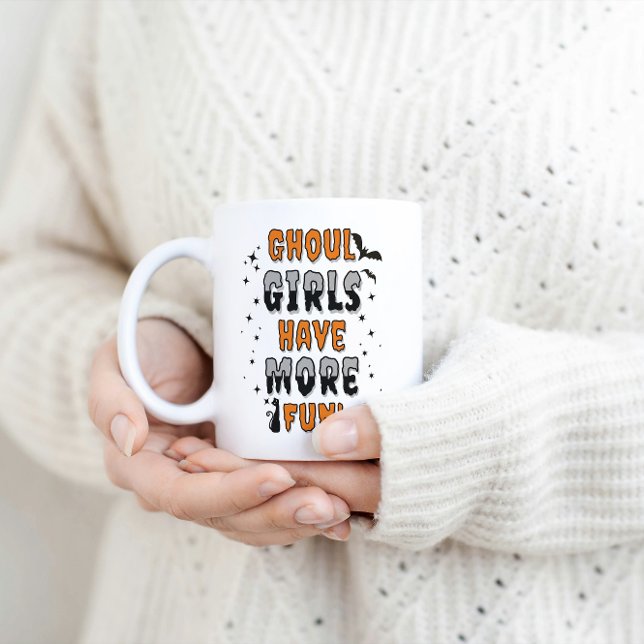 Ghoul Girls Have More Fun Modern Halloween  Coffee Mug (A woman holding a white coffee mug with Orange and black text saying Ghoul girls have more fun.)