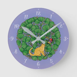 Ginger cat looks at a butterfly round clock