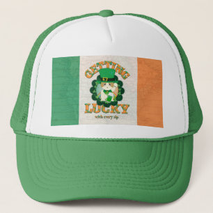 Ginger tabby with green beer trucker hat