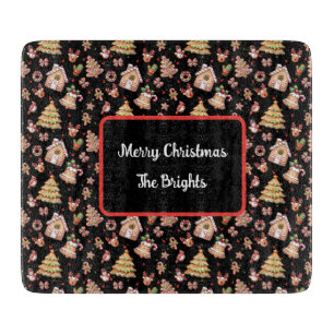 Gingerbread Christmas Cookies on Black Background Cutting Board