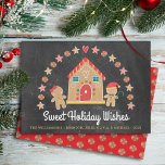 Gingerbread House Sweet Wishes Chalkboard Festive Holiday Card<br><div class="desc">“Sweet Holiday Wishes”. A cute, whimsical gingerbread house, gingerbread girl and boy, stars, hearts and candies, along with playful script typography, overlay a dark charcoal grey chalkboard background and help you usher in the holiday party season. A peppermint candy pattern over a red background adorns the back. Celebrate with family...</div>
