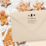 Gingerbread Man & Snowflakes Family Return Address Rubber Stamp<br><div class="desc">Make your mark this holiday season with our personalised wooden stamp. A cute gingerbread man and snowflakes adorn the top,  while your family name takes centre stage in a charming script font. Serif type elegantly displays your return address details,  adding a touch of holiday spirit to your correspondence.</div>