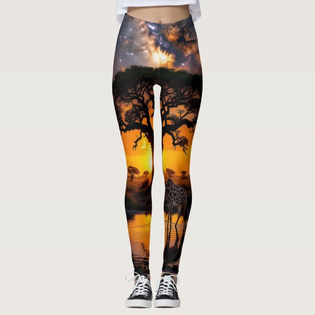 Giraffe drinking water in African Cosmic Sunset Leggings (Front)