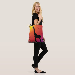 Giraffe in sunset shoulder tote bag