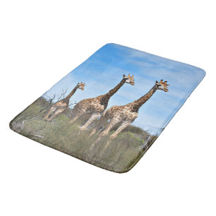 Giraffes in Sunlit Grassland Bath Mat