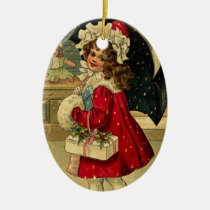 Girl carrying a christmas gift ceramic tree decoration