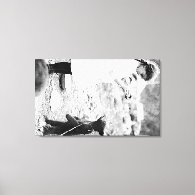 Girl Feeding Bear Cub in Seward Canvas Print (Front)