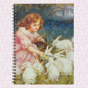 Girl feeding rabbits spiral notebook