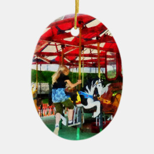 Girl Getting on Merry-Go-Round Ceramic Tree Decoration