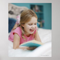 Girl laying in bed reading book