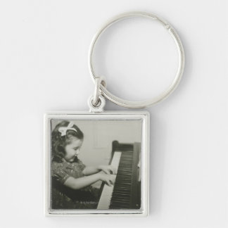 Girl Playing Piano Key Ring