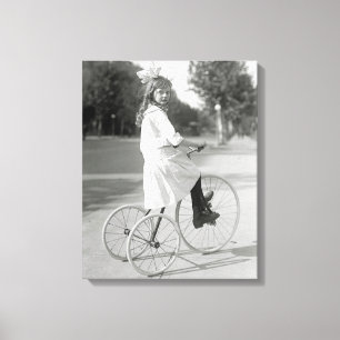 Girl Riding Tricycle, 1917 Canvas Print
