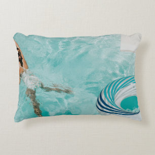 Girl wearing swimsuit and swims in swimming pool decorative cushion