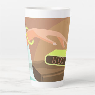 Girls hand pushing on alarm clock snooze button latte mug