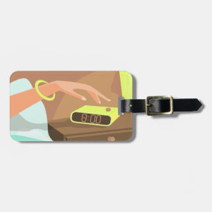Girls hand pushing on alarm clock snooze button luggage tag