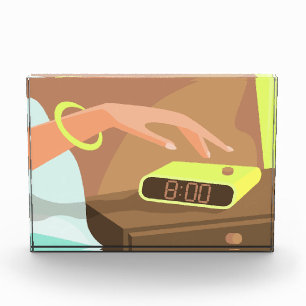 Girls hand pushing on alarm clock snooze button photo block