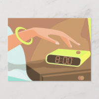 Girls hand pushing on alarm clock snooze button