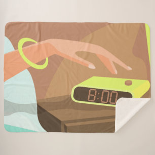 Girls hand pushing on alarm clock snooze button sherpa blanket