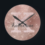 Girly Rose Gold Glitter Sparkle Glam Monogram Name Round Clock<br><div class="desc">This trendy and unique glam girly design features a large customisable monogram in pale rose gold in the centre in popular serif typography along with a customisable name in popular script with a hand-lettered look in dark grey. The background includes brushed rose gold metal and glimmering diamonds for added glitter...</div>