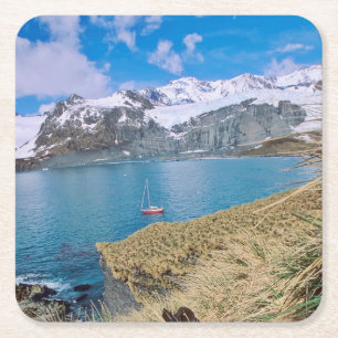 Glaciers and sailing yacht in background square paper coaster
