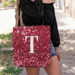 Glam Red Faux Glitter Bokeh Sparkles Monogram Tote Bag<br><div class="desc">A modern bold single letter monogram in white with a black drop shadow. The font size, colour and style are customisable. The background is a faux red glitter with sparkly spots or bokeh. Move or delete the tiny faux sparkle graphic images. Girly chic gift for a bridesmaid or other member...</div>