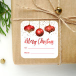 Glam Red Gold Ornaments Merry Christmas To From Square Sticker<br><div class="desc">This glam holiday gift sticker features a trio of red and gold faux foil and glitter ornaments, with a sprinkling of gold faux glitter in the background. The words "Merry Christmas" appear in elegant red faux foil calligraphy script, along with "TO" and "FROM" in red sans serif font on a...</div>