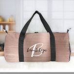 Glam Rose Gold Brushed Metal Black White Monogram  Duffle Bag<br><div class="desc">This personalised duffel bag features a monogram and first name in modern black and white script on a glam rose gold faux brushed metal background.</div>