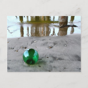 Glass float under pier postcard