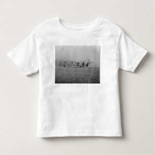 Glider being prepared for flight by toddler T-Shirt