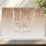 Glitter Drip 60th Birthday Gold Large Gift Bag<br><div class="desc">This chic 60th birthday party gift bag features a sparkly gold faux glitter drip border and gold ombre background. Personalise it with her name in handwriting script,  along with her birthday and date below.</div>