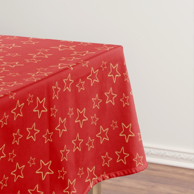 Glittering Golden Star Silhouettes on Vivid Red Tablecloth (In Situ)