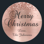 Glittery Rose Gold Foil Merry Christmas Family Classic Round Sticker<br><div class="desc">Fancy calligraphy Merry Christmas envelope seal stickers for your holiday greeting cards.
Customise the font size or style for your family name as needed.
The sparkly rose gold glitter and brushed metallic style foil are digital art elements that print like a photo.</div>